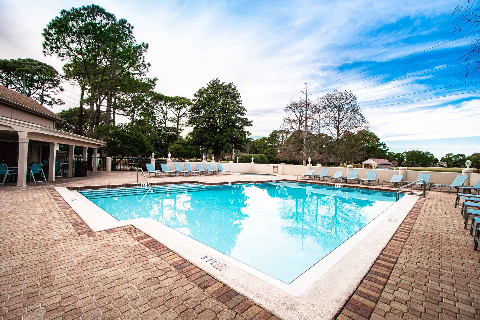 A spacious outdoor swimming pool at VRI's Bay Club of Sandestin in Florida.